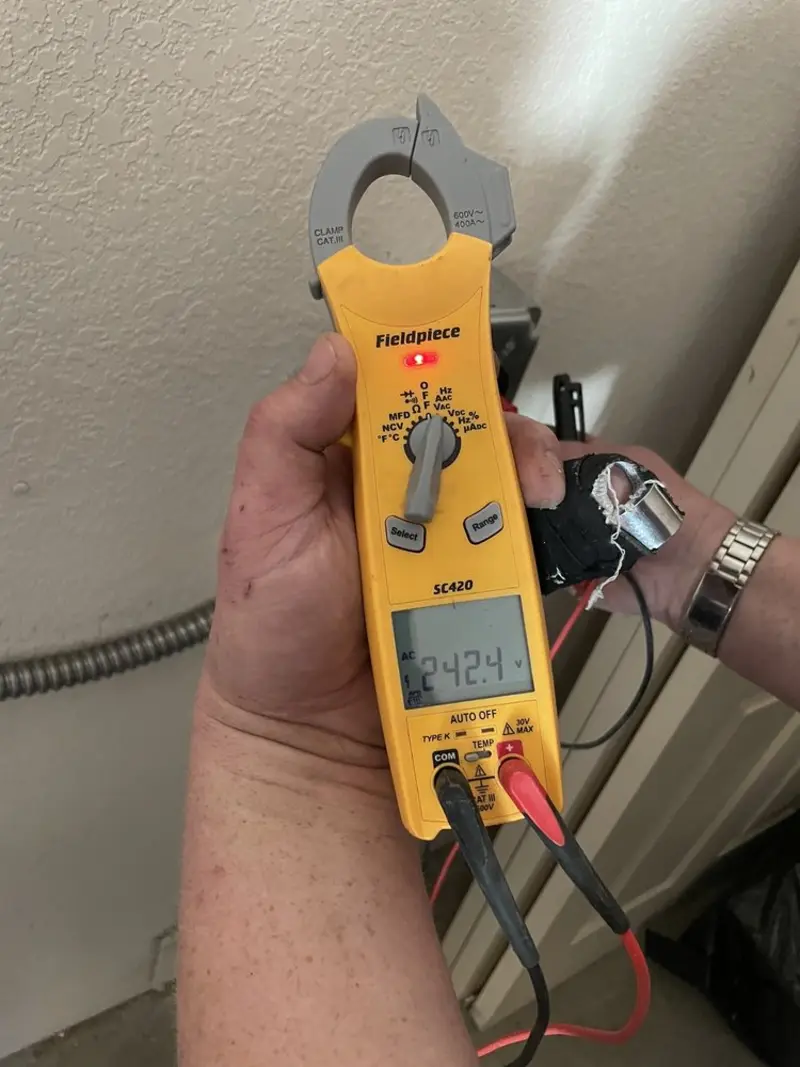 Voltage testing with clamp meter during Ceiling Fan Installation in Barrington